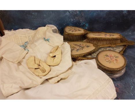 A mid 20th century child's christening gown;&nbsp; another, cotton;&nbsp; a pair of Rock-a-Bye shoes;&nbsp;&nbsp;;&nbsp; &nbs