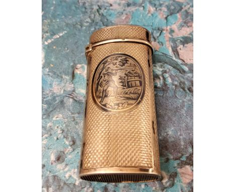 A 19th century silver and niello vesta case, oval cartouche with huntsman, engine turned, 6cm high, c.1880 