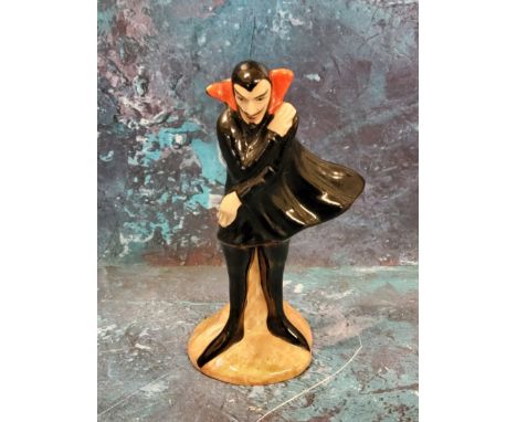 A Carlton Ware Mephisto&nbsp;Series figure, he stands, wearing a black cape, 11cm high, printed mark 