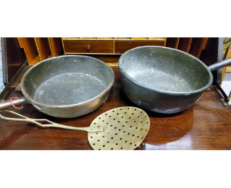 A Victorian copper roll top pan, metal handle, 31cm wide, c.1860;&nbsp; another, turned wooden handle top, 33cm diam;&nbsp; a