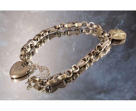 An 18th century cut steel part chatelaine chain reworked as a bracelet, later silver padlock clasp &amp; charm 