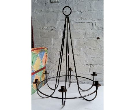 A wrought iron six branch chandelier 