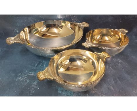 A large E.P.N.S. two handled bowl, the handles cast with Celtic strapwork, 31.5cm diam, James Dixon and Sons; others, smaller