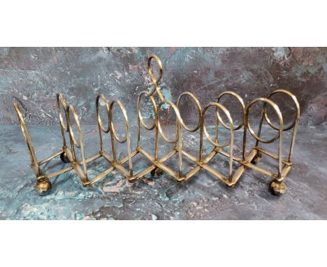 A Victorian silver plated seven-bar concertina toast rack, loop handle, bun feet,&nbsp; 40cm long extended 