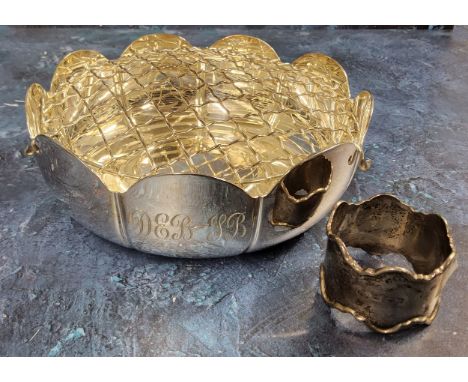 A silver rose bowl in the form of a flower, SC, Sheffield 1985; a silver napkin ring, rubbed marks total weight 377g 