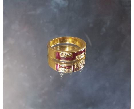 A continental 18ct gold ruby &amp; diamond ring, chanel set with seven baguette rubies &amp; three round diamonds, stamped 75