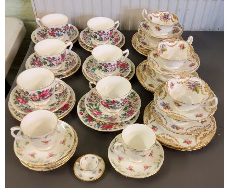 A Royal Doulton tea service, for six, printed with roses,&nbsp; Cupids's bow and arrow and gilt swags, printed marks;&nbsp; a