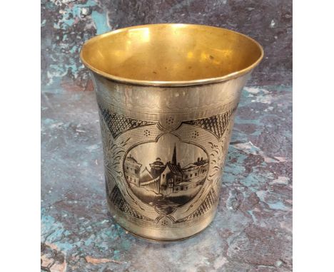 A Russian silver and niello flared cylindrical beaker, engraved with buildings, 9cm high, Mikhail Dimitriyev, Moscow, 1870, 1