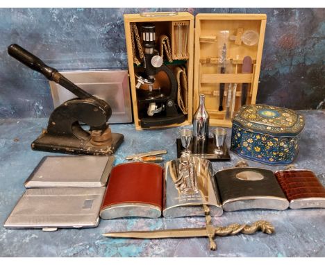 A Towa microscope, boxed;&nbsp; hip flasks;&nbsp; chrome plated cigarette box;&nbsp; pen knives;&nbsp; cast iron stamp;&nbsp;