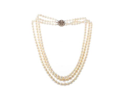 THREE STRAND PEARL NECKLACE with turquoise and seed pearl clasp, marked 9CT