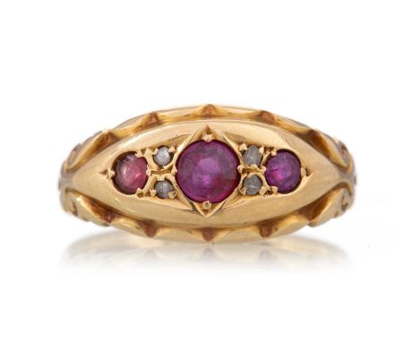VICTORIAN RUBY AND DIAMOND RING set with three rubies interspaced by pairs of diamond chips, in eighteen carat gold, size NQt