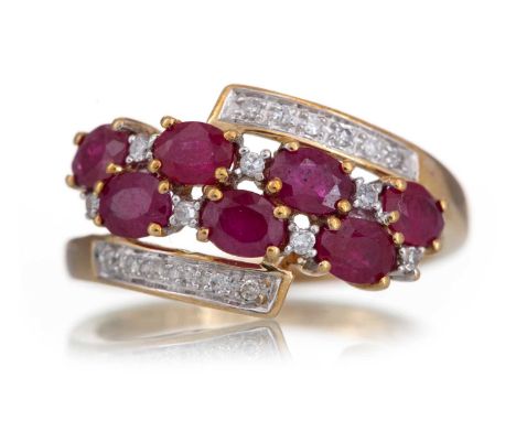 RUBY AND DIAMOND RING set with oval rubies interspaced by small diamonds, between a diamond border, in nine carat gold, size 