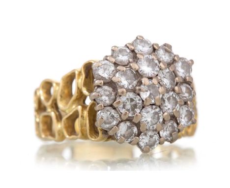 DIAMOND CLUSTER RING WITH PIERCED SHANK set with round brilliant cut diamonds totalling approximately 1.20 carats, unmarked, 