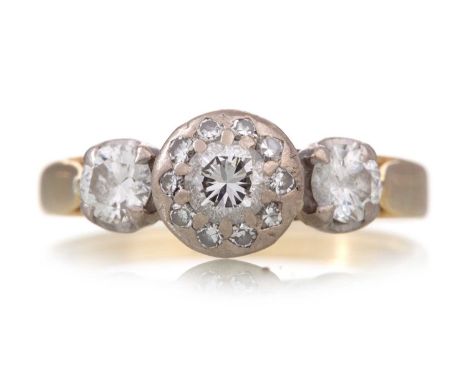 DIAMOND DRESS RING the central section set with a round brilliant cut diamond within a halo of smaller stones, flanked by a f