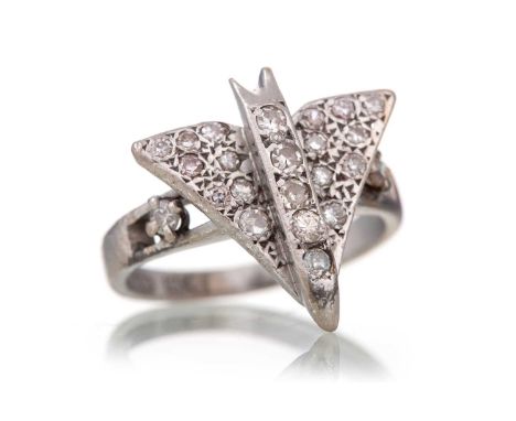 DIAMOND 'CONCORDE' RING modelled with a raised panel in the form of the aircraft Concorde, encrusted with small round brillia