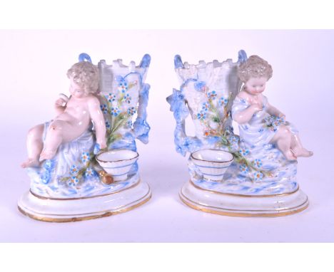 Wallendorf - Two German early 19th century porcelain vases / figures in a blue and white colourway. Both feature a cherub fig