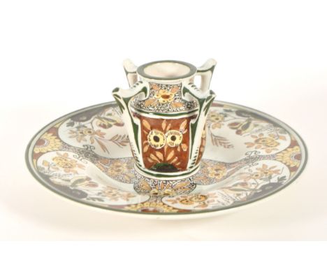 Gouda Zuid Holland glazed pottery wall plate with integrated central vase pot. Early 20th century circa 1920s majolica earthe