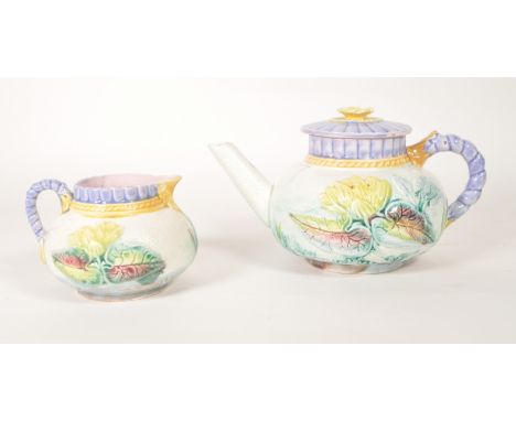 Samuel Lear majolica 19th century ceramic teapot with milk jug. Water lily pattern on a white ground with purple handle and l