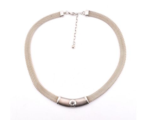 A contemporary 925 silver and topaz choker necklace. The necklace having a mesh link chain to central bar set with a round cu