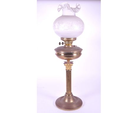Early 20th century Edwardian brass corinthian column table oil lamp base with burner and glass shade. Raised on a circular pl