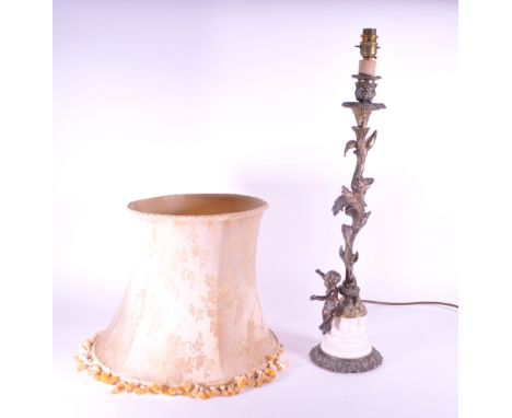Spanish late 20th century brass table lamp with large shade. Brass table lamp with foliage style mouldings to the arm, cherub