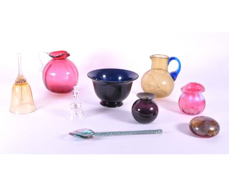 Collection of 19th and 20th century glass pieces. Examples include a Victorian 19th century cranberry jug and small vase, an 