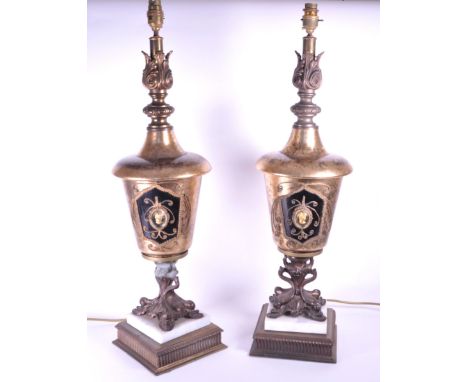 A pair of 20th Century Rococo style table lamps having an urn shape with a gilt crackle glaze style exterior, central cameo p