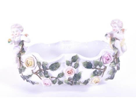 Sitzendorf - Late 19th century porcelain flower basket bowl encrusted with hand painted relief flowers and leaves to the exte