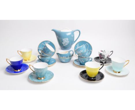 Collection of late 20th century china and pottery tea service pieces. Comprised of Royal Albert china tea cups and saucers, i