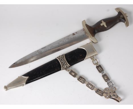 A German Third Reich SS (Shutzstaffel) dagger, the 22cm double edged blade etched "Meine Ehre heisst Treue" (My honour is loy