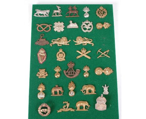 A collection of British Army badges and insignia, to include Machine Gun Corps, The Duke of Wellington's Regiment (West Ridin