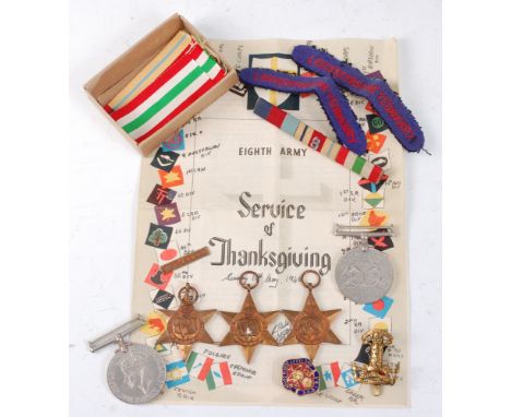 A group of five WW II medals to include 1939-1945 Star, Africa Star with 8th Army clasp, Italy Star, Defence and War, togethe