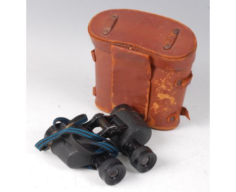 A pair of U.S. army 60 x 30 binoculars marked Wollensak Rochester U.S.A, in a fitted leather case.