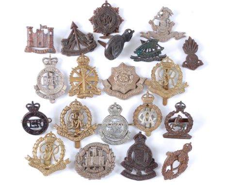 A collection of cap badges and insignia to include Royal Military Academy Sandhurst, George V/VI Military police, Royal Army 