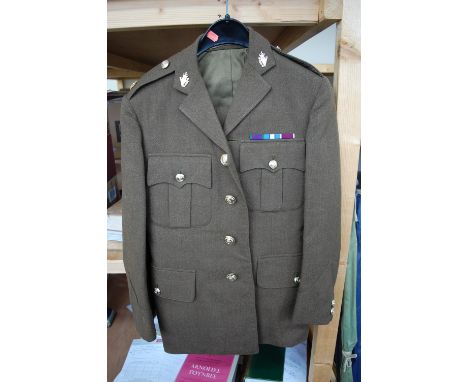 A British Army No 2 Jacket with matching trousers for The Ulster Defence Regiment, together with two mess uniforms.