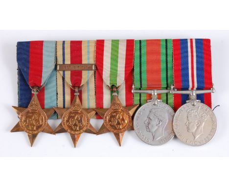 A group of five WW II medals to include 1939-45 Star, Africa Star with 8th Army clasp, Italy Star, Defence and War. (5)