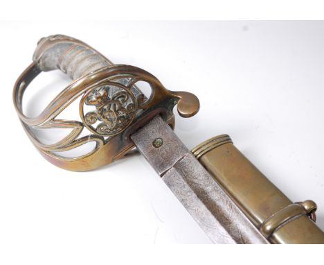 A British 1845 pattern Infantry Officer's sword, the 82cm curved fullered blade etched with a crowned VR cypher within foliag