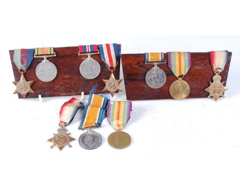 A family group of medals and effects to include 1914 Mons Star, British War and Victory, naming 3-9357 PTE. J. DILLEY. 2/SUFF