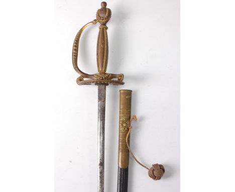 A George V court dress sword, the 80cm flattened oval blade etched with stands of arms and foliage, having a clam shell langu