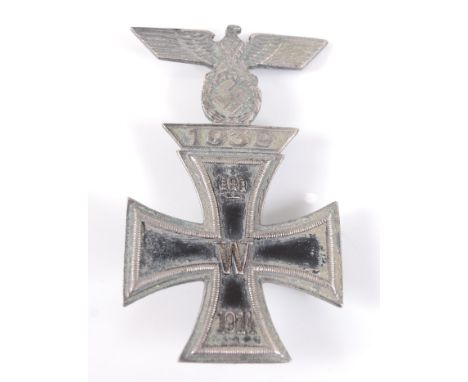 A German Iron Cross 1st class with combined 1939 bar, the whole of one piece construction with pin back.Condition report: We 