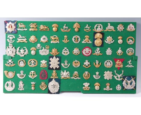 A collection of British Army cap badges and insignia, mainly Infantry Regiments to include The Queen's (Royal West Surrey), T