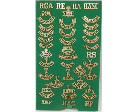 A collection of British Army brass shoulder titles to include Cheshire, Cornwall, Bedfordshire and Hertfordshire, Royal Norfo