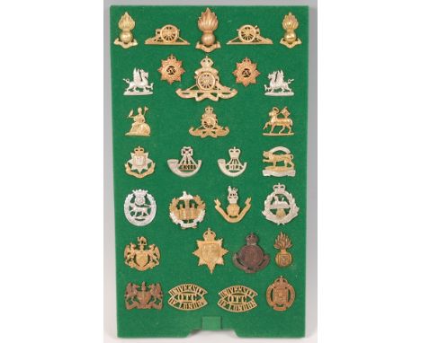 A collection of British Army cap badges and insignia, to include Oundle Officer Training, University of London Officer Traini