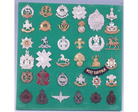 A collection of British Army cap badges and insignia, mainly Infantry Regiments to include Royal Hampshire, Middlesex Regimen