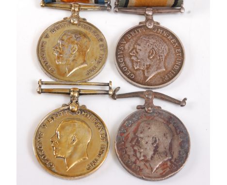 A collection of four WW I British War medals, naming 0663. A. SJT. B. CURTIS. DEVON. R., L - 12439. DVR. M.J. TANDY. R.A., 20