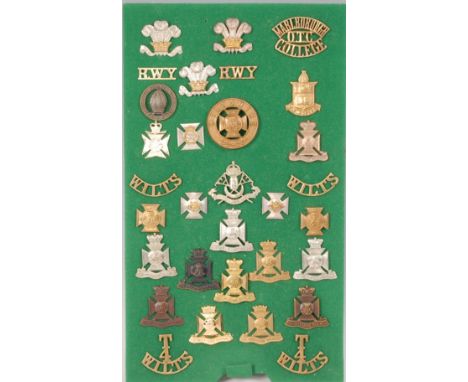 A collection of British Army cap badges and insignia, mainly Wiltshire Regiments to include Marlborough Officer Training Coll