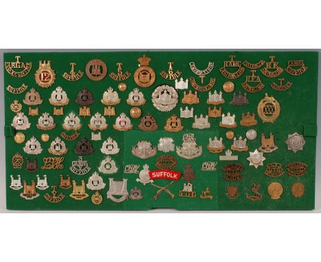 A collection of British Army cap badges, collar badges and insignia, mainly East Anglian Regiments to include The Cambridgesh