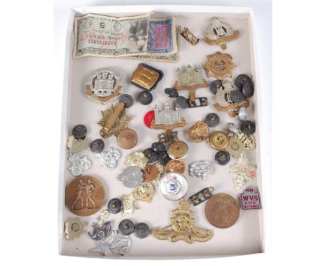 A collection of cap badges, buttons and bank notes, to include Northamptonshire Regiment, Army Service Corps, Cambridgeshire 