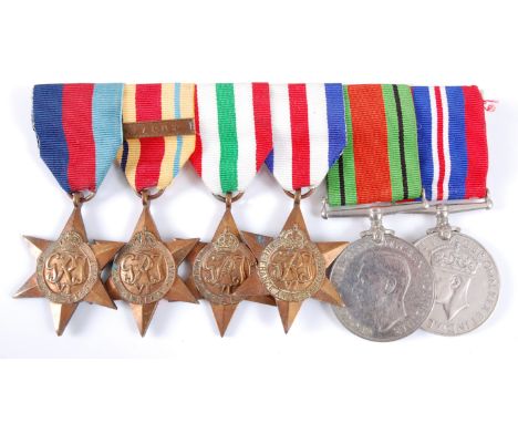 A WW II group of six to include 1939-1945 Star, Africa Star with 1st Army clasp, Italy Star, France and Germany Star, Defence