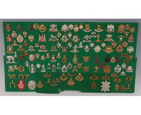 A collection of British Army cap badges, collar badges and shoulder titles, mainly Cavalry Regiments to include The Queen's B